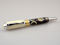 Casein over Watch Part on Rhodium, 22k Gold Rollerball